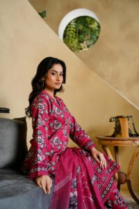 trendy clothes in 2026 Model in vibrant floral attire poses elegantly indoors in Lahore.